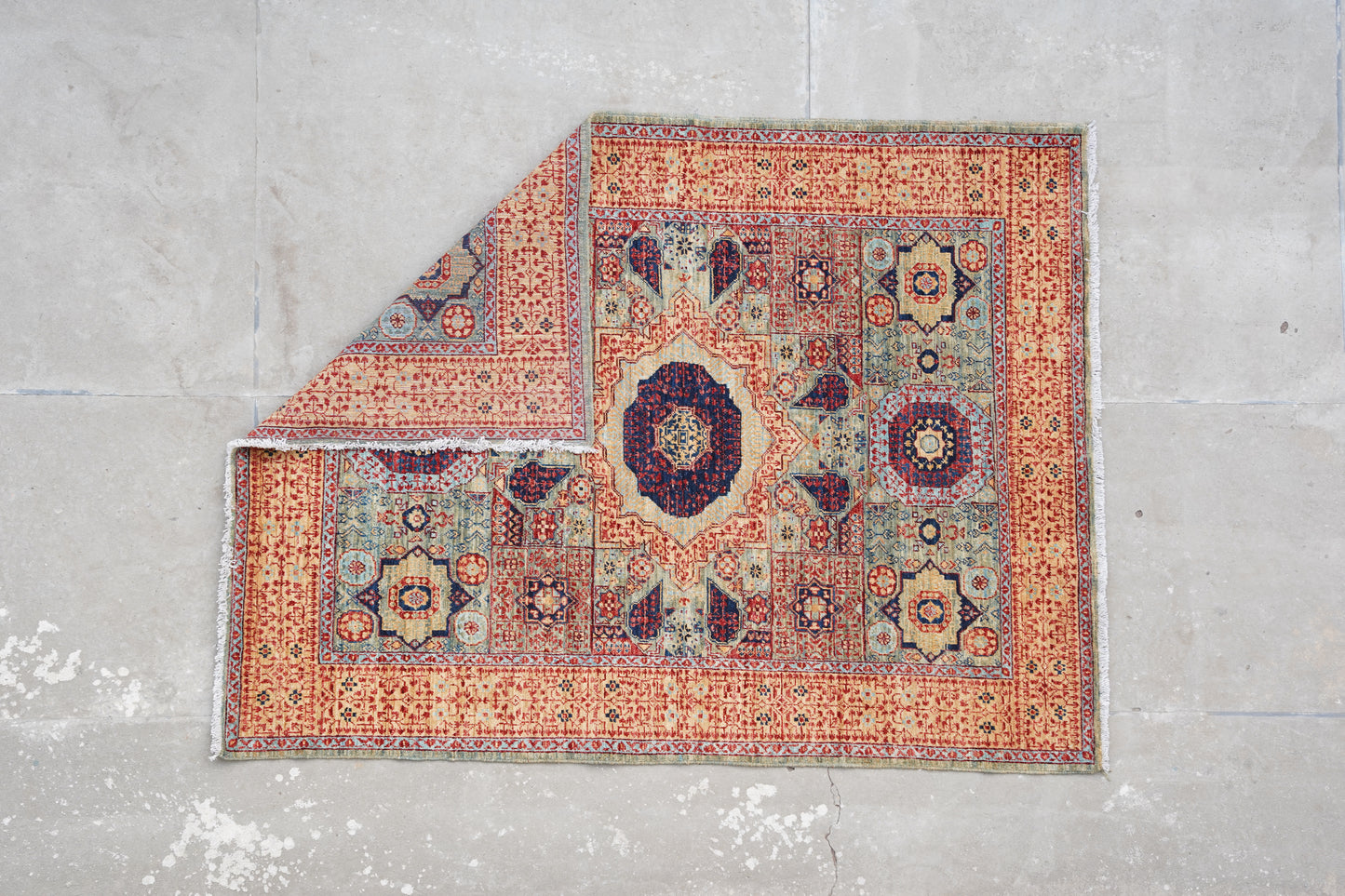 The Arched Heritage: Traditional Afghan Rug in Earthy Tones